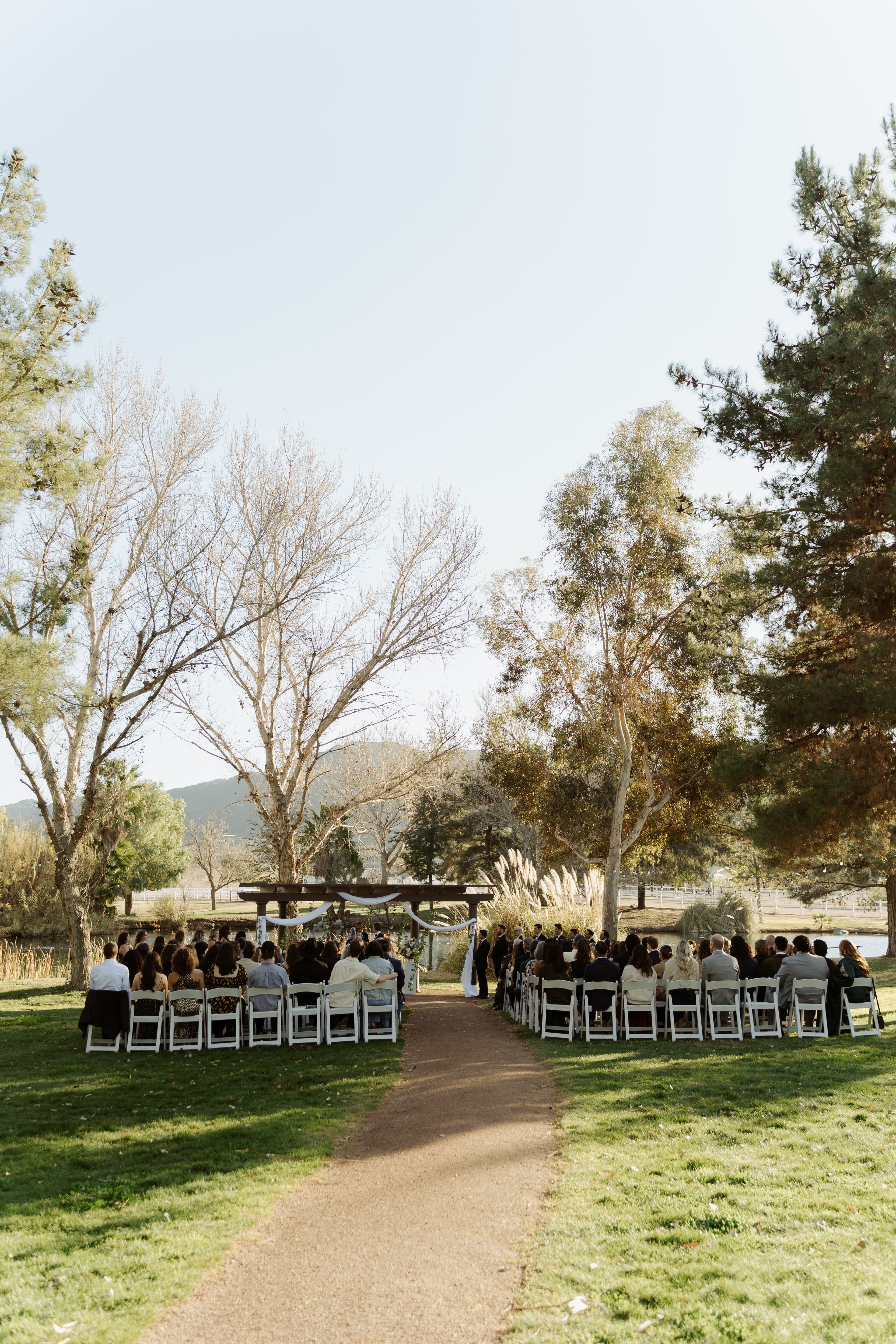Outdoor wedding ceremony on the lawn at Hawk Ranch